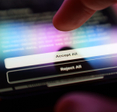 Finger selecting Accept All on a cookies pop-up.