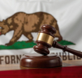 A gavel before the Californian flag.