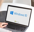 Notebook with Microsoft Windows 10 logo.