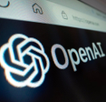Close-up view of OpenAI logo on its website.