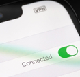 Apple iPhone with VPN settings on screen.
