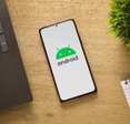 Android logo on phone screen.