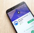 VPN: Fast and Unlimited NordVPN app on Google Play Store website displayed on phone screen.