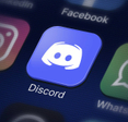 A closeup of Discord app icon on smartphone