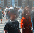 Crowd of people unknowingly getting their faces scanned.