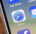 Close up to safari app on the screen of an iPhone X with personalized background