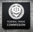 Closeup of the FTC logo on a building
