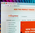 Aliexpress.com website homepage on Apple iMac monitor screen.