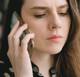 Woman engaged in a phone conversation.