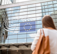 Young businesswoman standing back near the Parliament building of European Union in Brussel city.