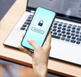 Woman inputting password on her phone.