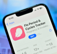 Flo period tracking app download page on the screen of an iPhone.