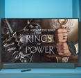 Smart TV displaying 'The Lord of the Rings, The Rings of Power' with blue background