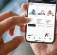 User selecting new Amazon "Buy for Me" feature on phone screen.