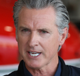 Governor Gavin Newsom speaking at a conference.