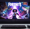 Gaming setup displaying Fortnite artwork on widescreen monitor
