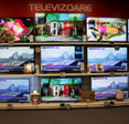 Shelves full of LED TVs in a store.