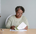 Granny's counting the money.