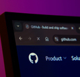 Close-up of a computer screen displaying the Github web interface in dark mode.