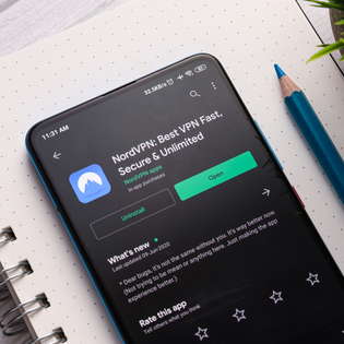 A photo of an Android phone with NordVPN selected in the Google Play Store.