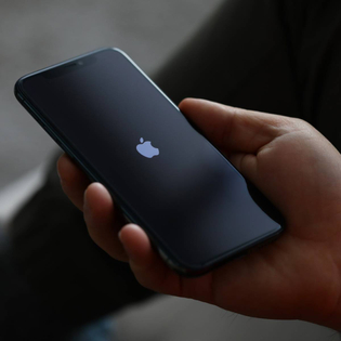 Hand holding Apple iphone pro