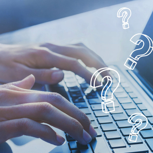 Fingers typing on keyboard with question marks overlayed