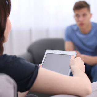 Psychologist using table during therapy session