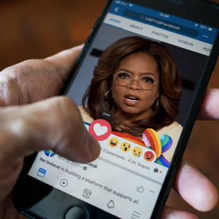 Oprah ad on Facebook with person hitting love heart icon