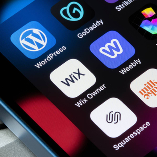 Assorted website builder apps on smartphone