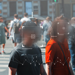 Crowd of people unknowingly getting their faces scanned.