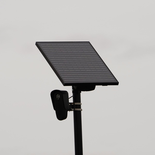 Flock safety police law enforcement license plate reader set up outside to help catch vehicle speeders.