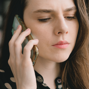 Woman engaged in a phone conversation.