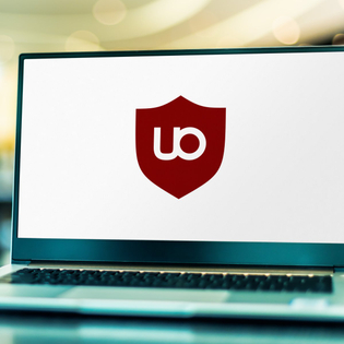 Laptop computer displaying logo of uBlock Origin.