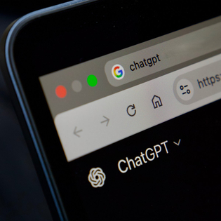 ChatGPT website open on laptop.
