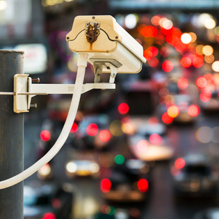 Back view of CCTV camera recording traffic.