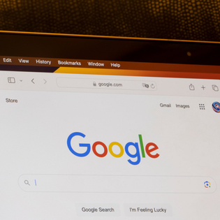 Google's website homepage is seen on a MacBook Air laptop.