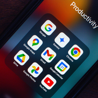 Various Google productivity apps like Gemini, Chrome, Maps, Gmail, Drive, Photos, and YouTube are displayed on a smartphone screen.