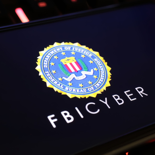 Smartphone screen with logo lettering of FBI Cyber.