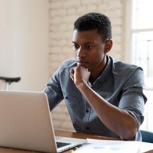 Man looking at a laptop computer