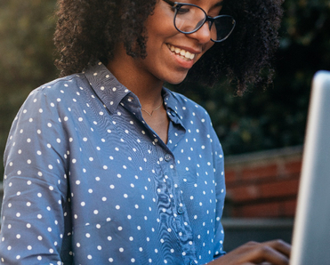 woman looking at her laptop computer