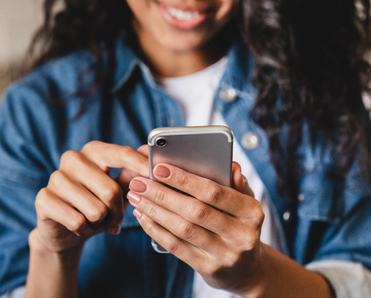 woman tapping on her phone