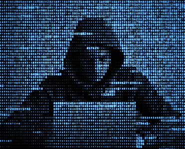 A hacker is using a laptop to enact a cyberattack.