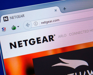 Homepage of NETGEAR website on the display of a PC.