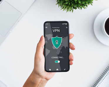 Young woman holding and using smartphone while connecting to a VPN app with a map in the background.