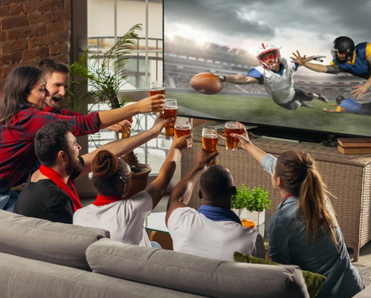 A group of friends in a living room drinking beer and watching a football game on the TV.