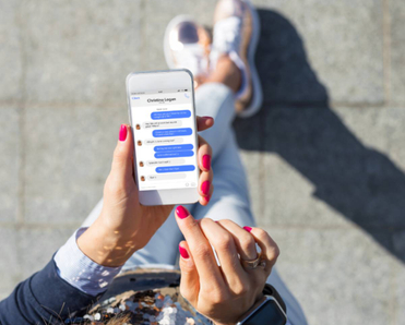Woman using instant messaging app on mobile phone