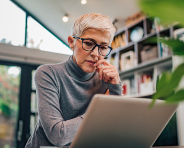 Woman looking at laptop