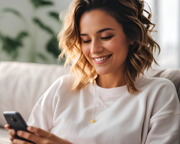 Woman smiling at phone