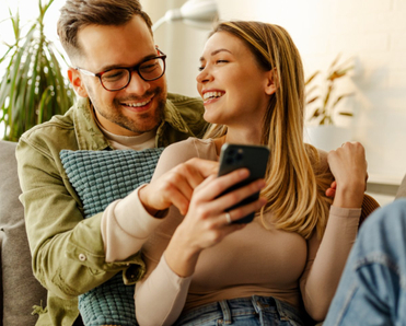 Woman and man looking at phone