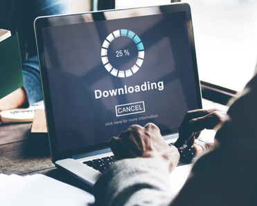 Man on laptop downloading a file